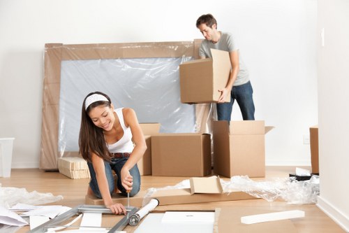 Boxes and furniture ready for transport on a residential street