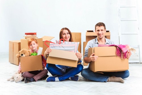 Professional movers handling household belongings carefully