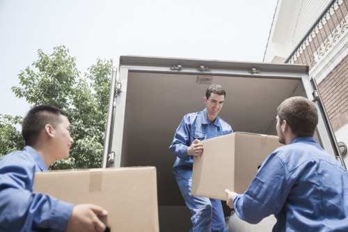 Kentish Town Man And Van team loading items safely with protection equipment
