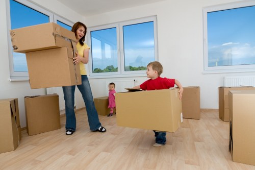 Furniture and boxes being loaded into a van for transport